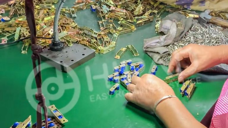 Blue wheel rollers are being assembled in the HIPAD workshop.